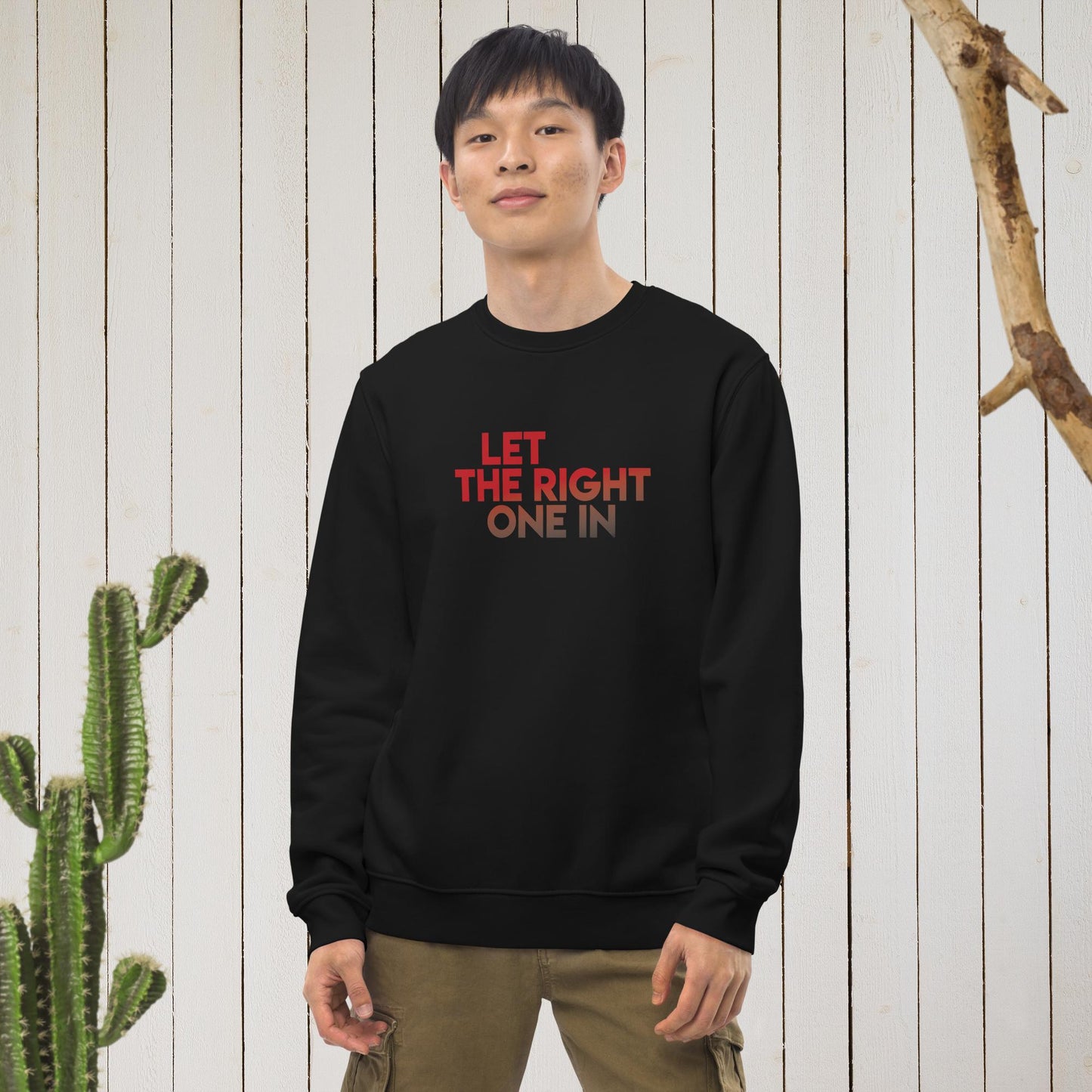 Positive organic cotton sweatshirt that promotes sustainability and self-love in a vampire film setting