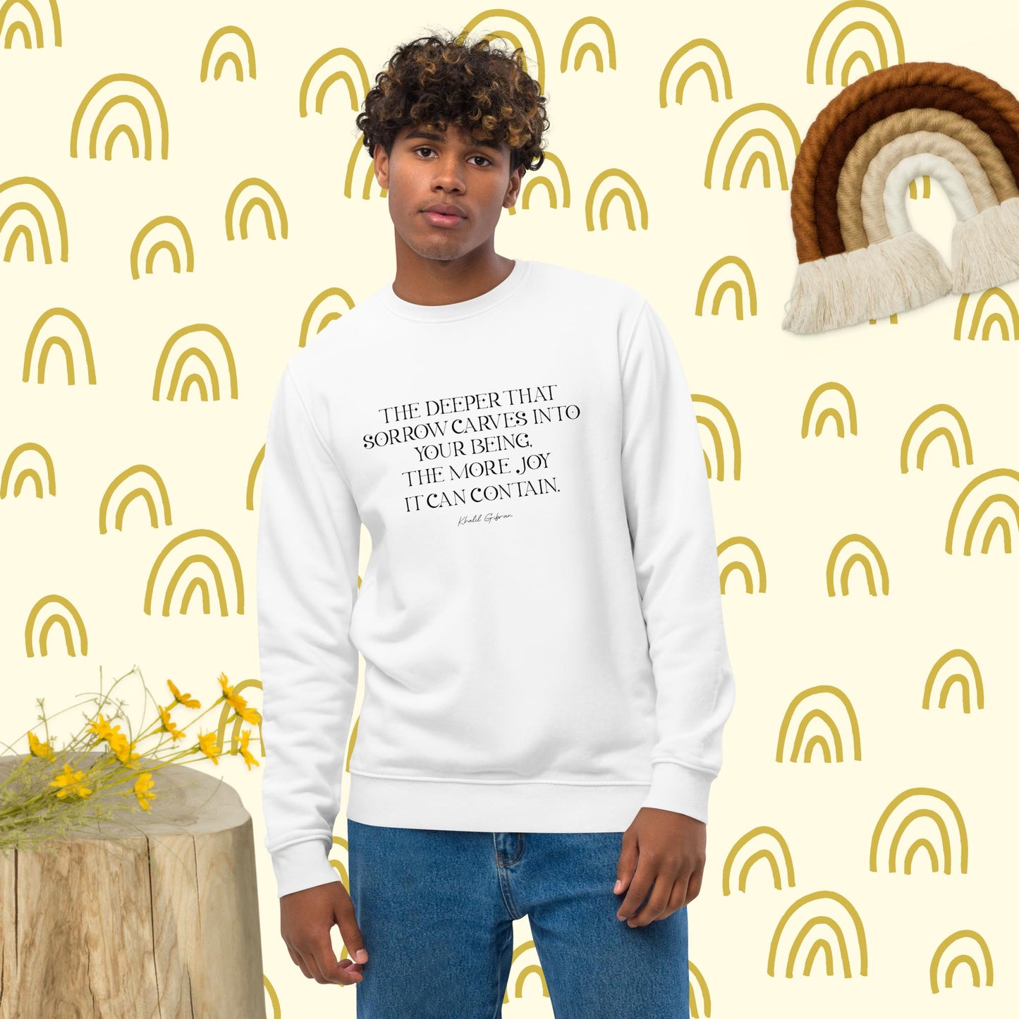 Stand out in the "Famous Quotes 'Joy & Pain' Khalil Organic Cotton Sweatshirt" with graphic slogans.