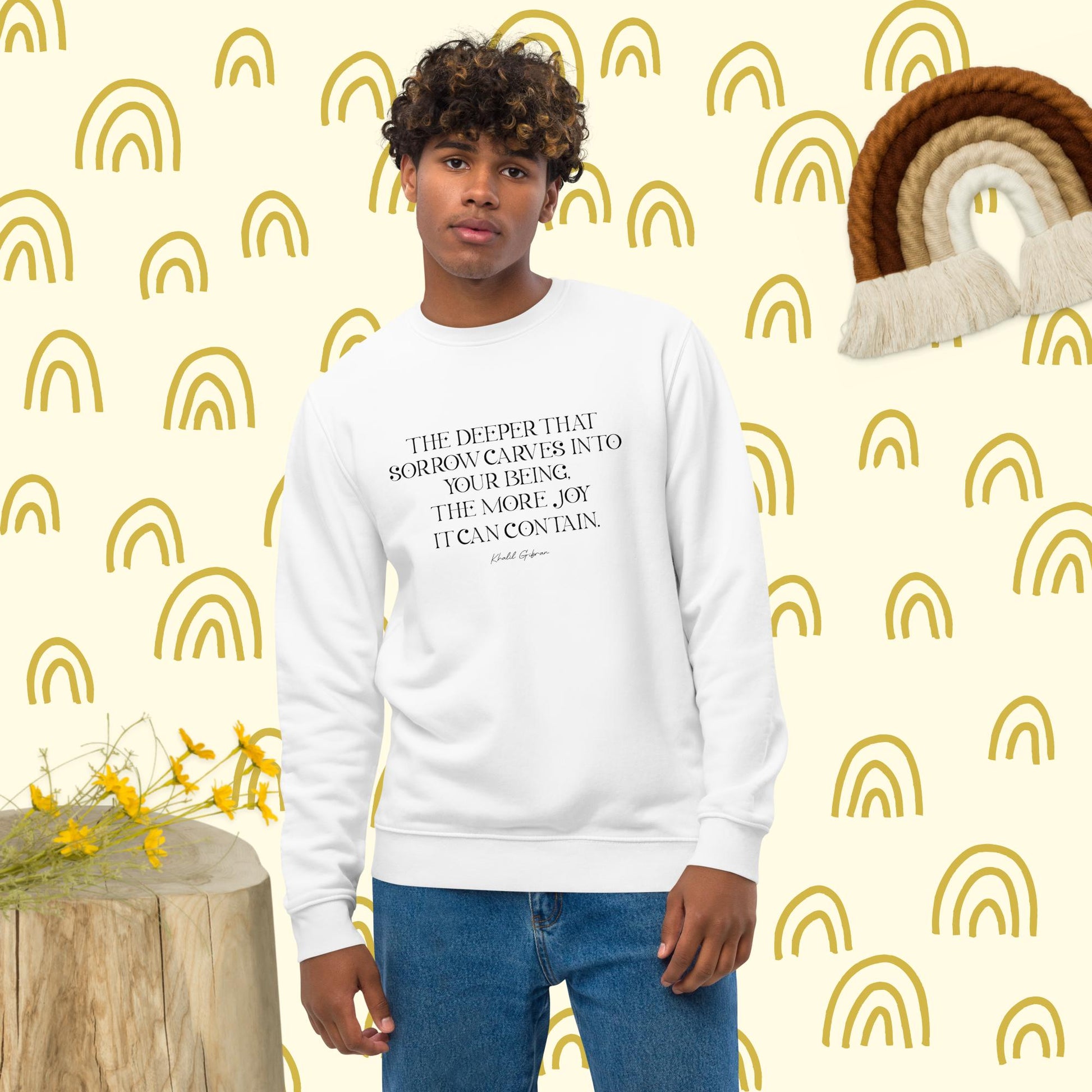 Stand out in the "Famous Quotes 'Joy & Pain' Khalil Organic Cotton Sweatshirt" with graphic slogans.