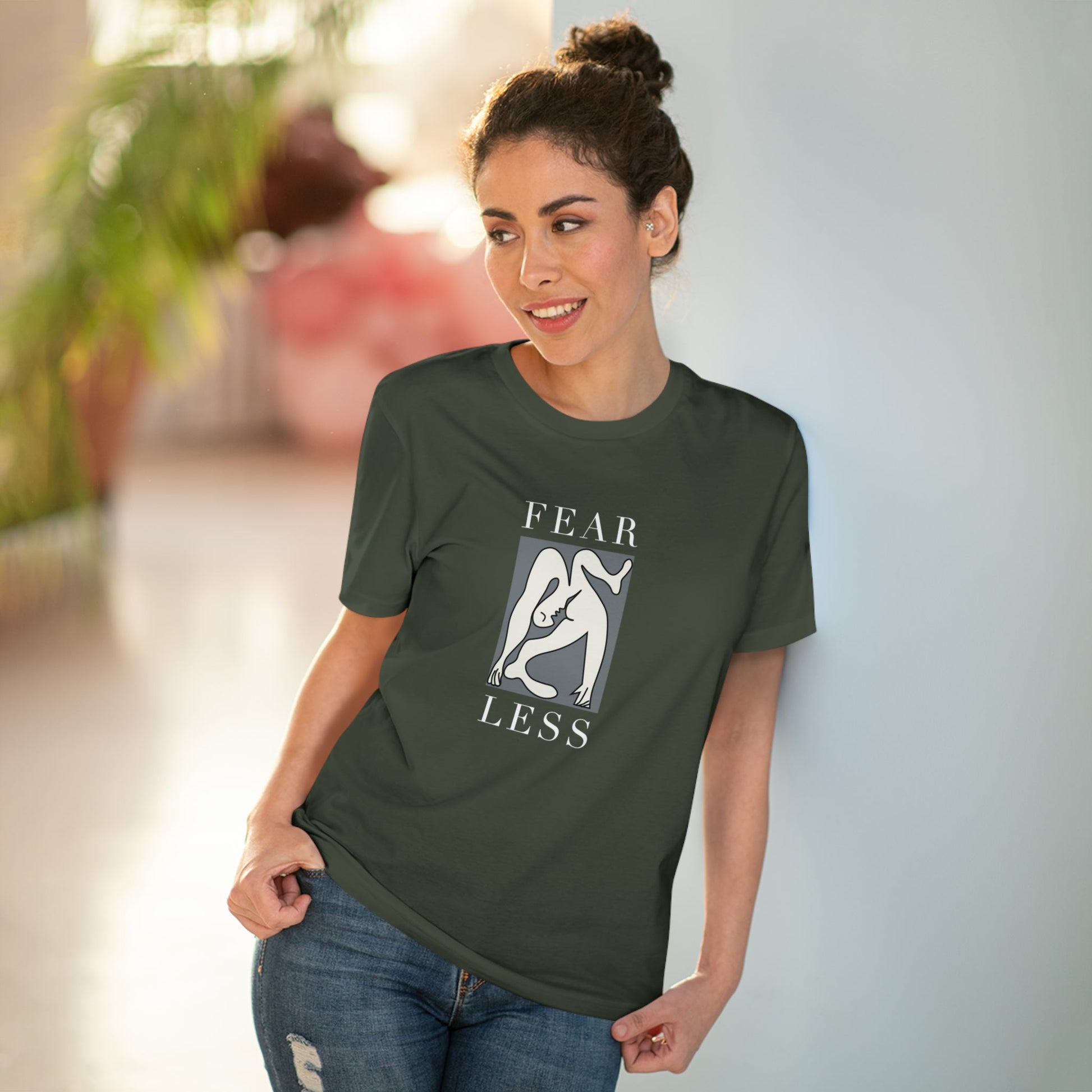 Show your strength in the feminist 'Fear Less' organic cotton t-shirt, a bold black t-shirt for women.