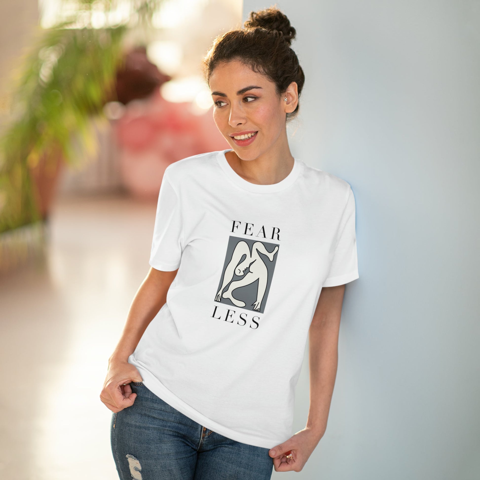 Break barriers in the feminist 'Fear Less' organic cotton t-shirt, a bold non-binary tee.
