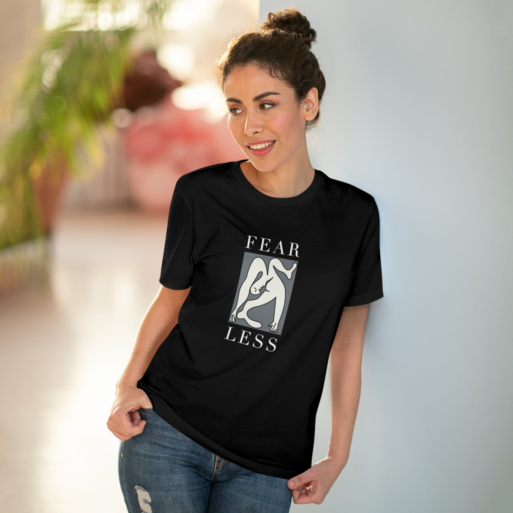 Stand strong in the feminist 'Fear Less' organic cotton t-shirt, a powerful feminist slogan t-shirt.