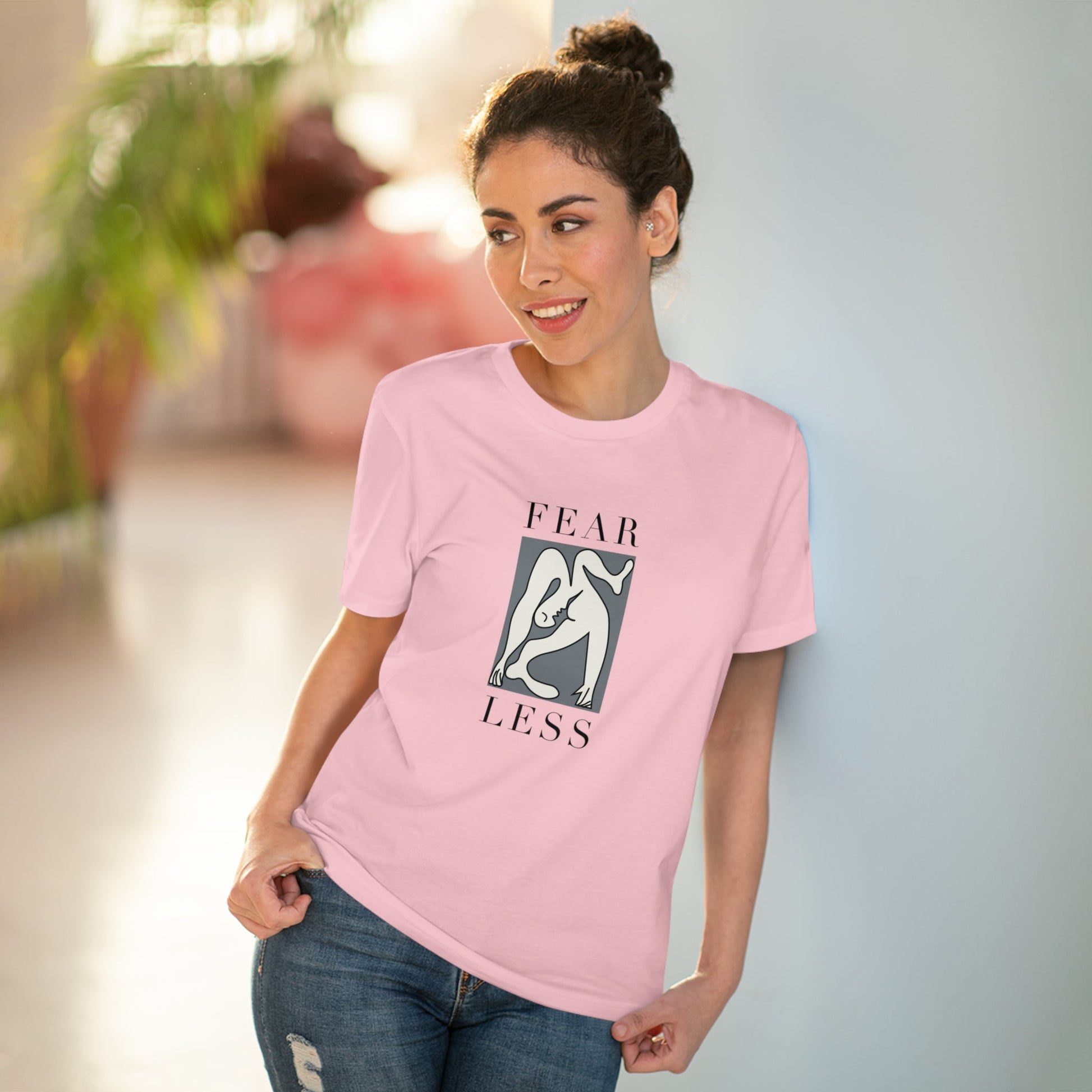 Step up for change with the feminist 'Fear Less' organic cotton t-shirt, ethically made and unisex.