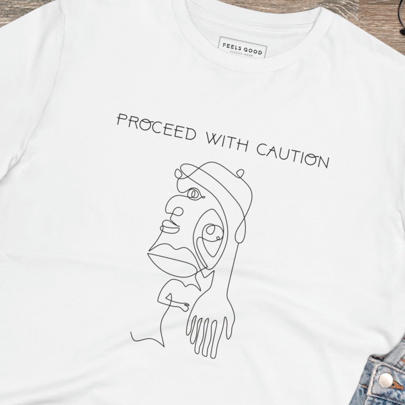 A bold choice for equality – the feminist 'Proceed With Caution' organic cotton t-shirt is here!