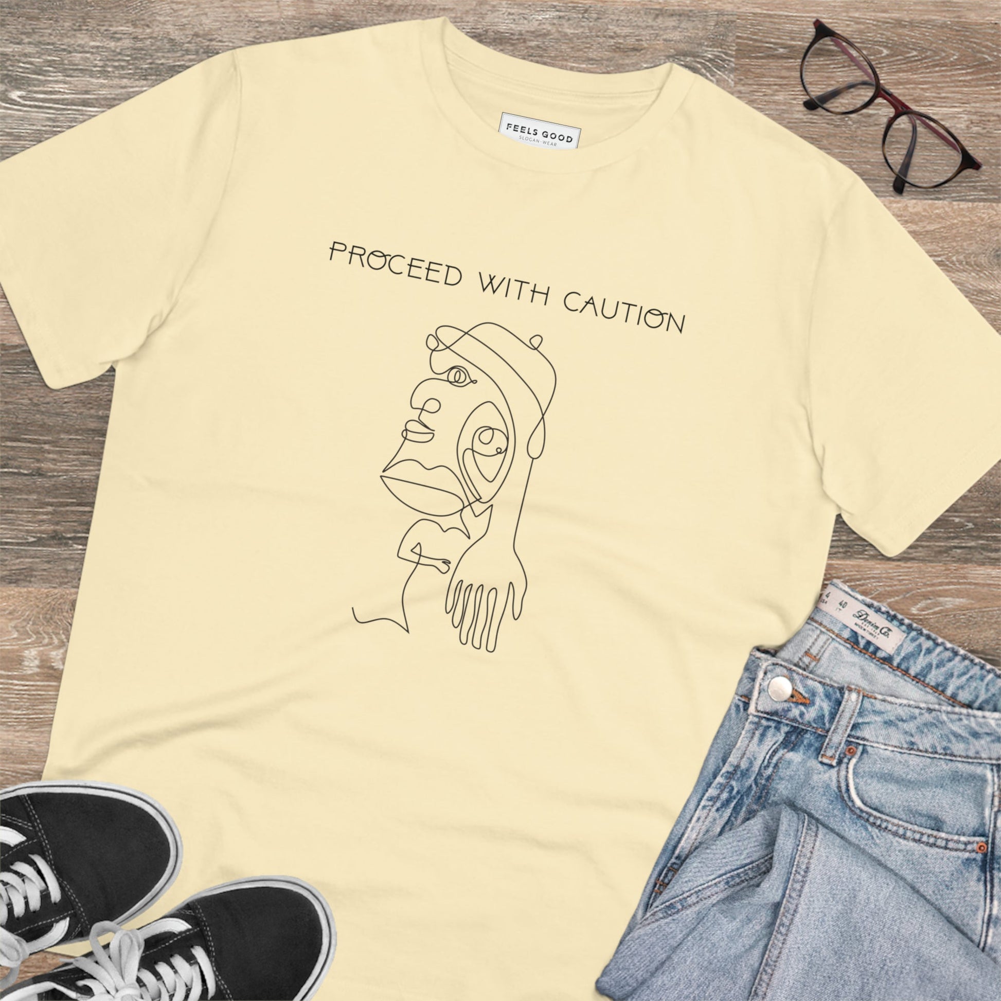 Statement-making style with the feminist 'Proceed With Caution' organic cotton t-shirt – UK-made.