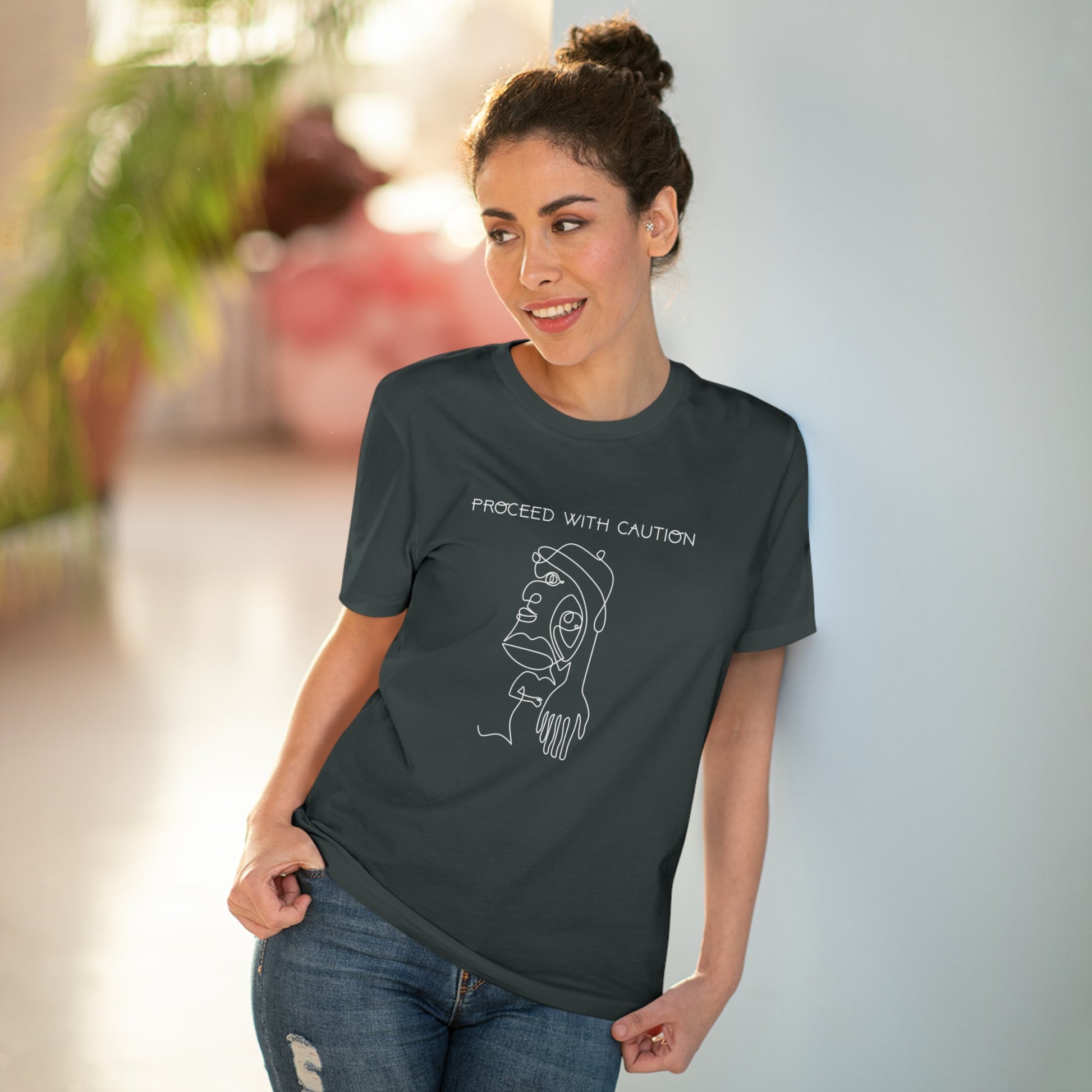 Express yourself with the feminist 'Proceed With Caution' organic cotton t-shirt – stylish & powerful.
