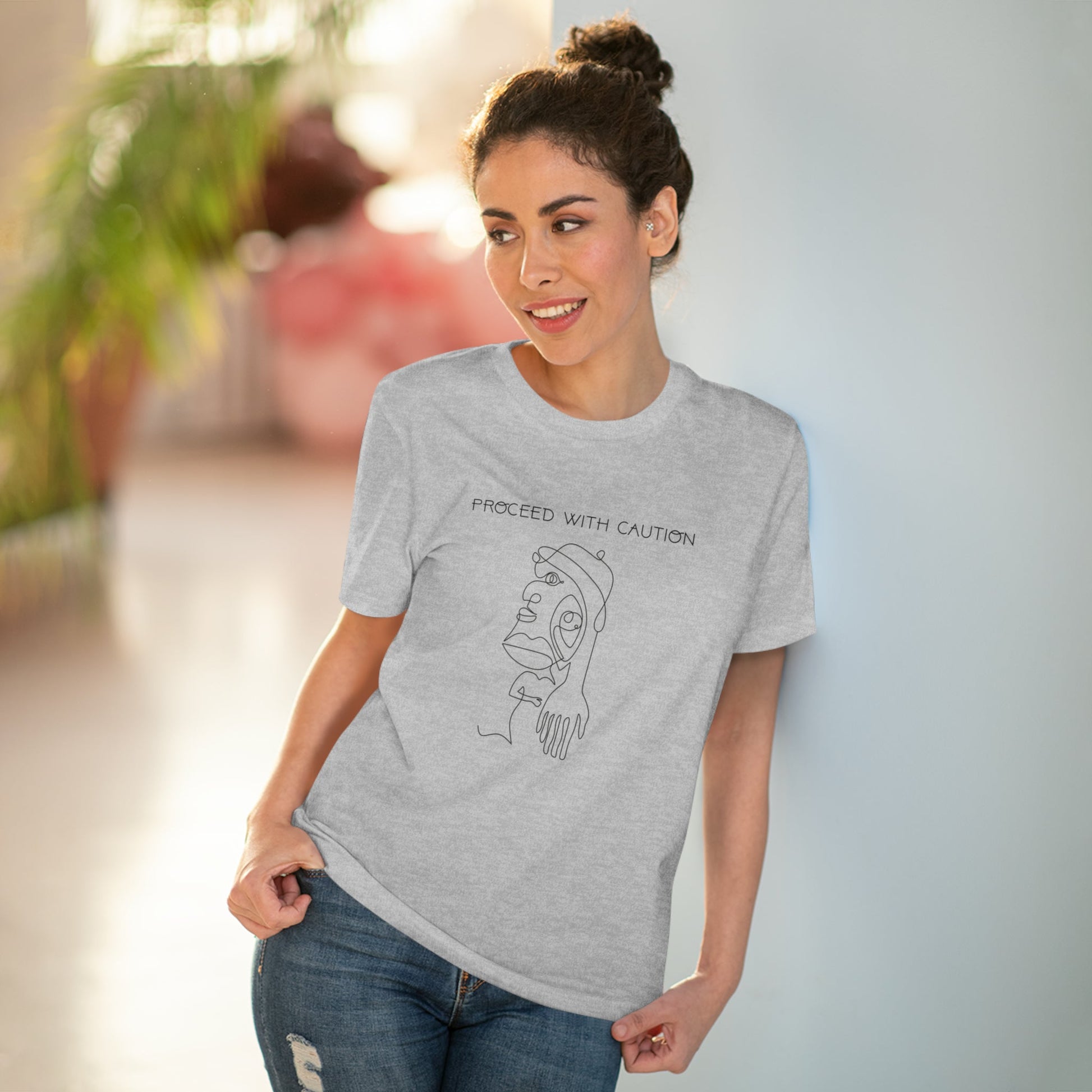 Rock the feminist 'Proceed With Caution' organic cotton t-shirt – empowering fashion for all.