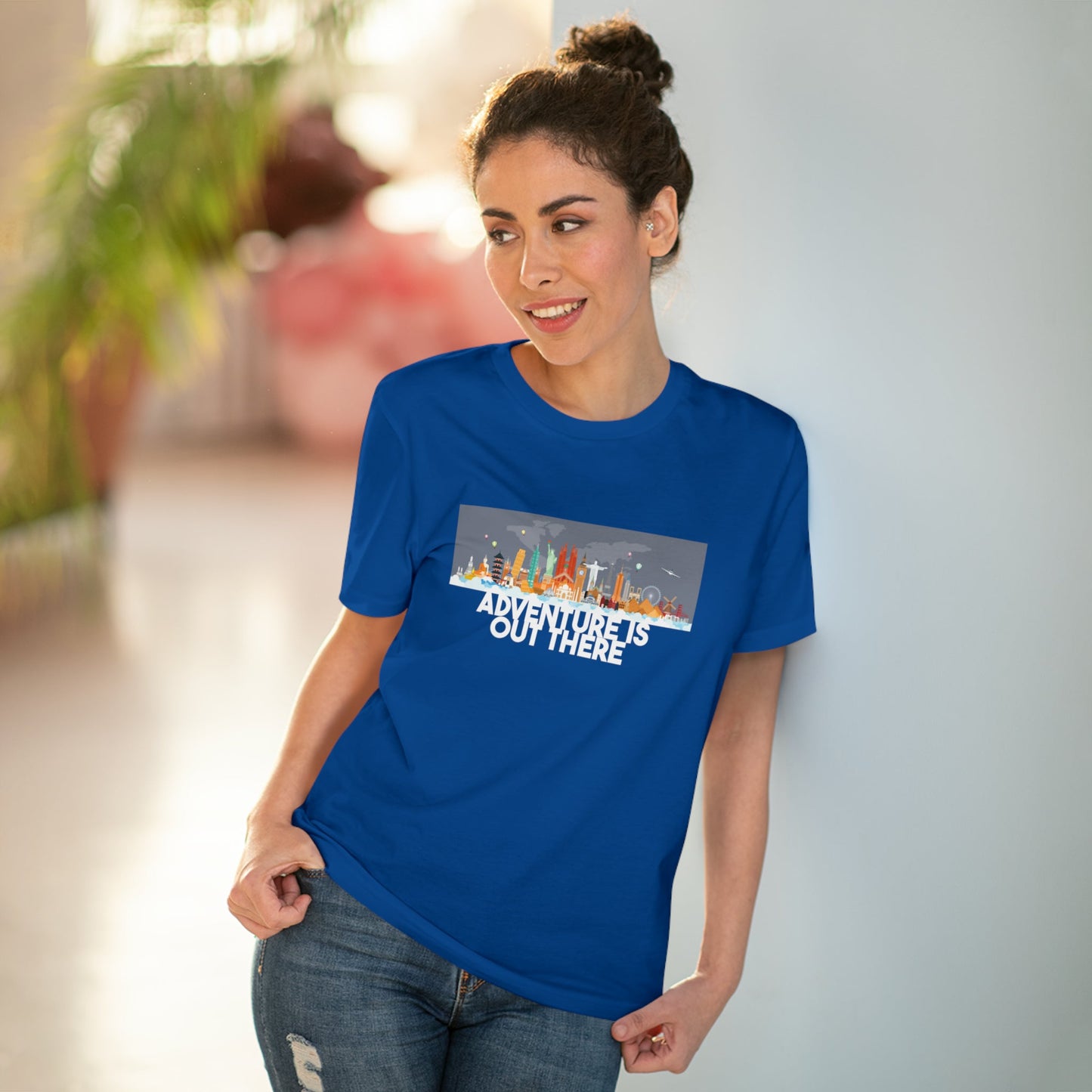 Travel light, travel free! The Travel 'Adventure Is Out There' organic cotton t-shirt is your go-to.